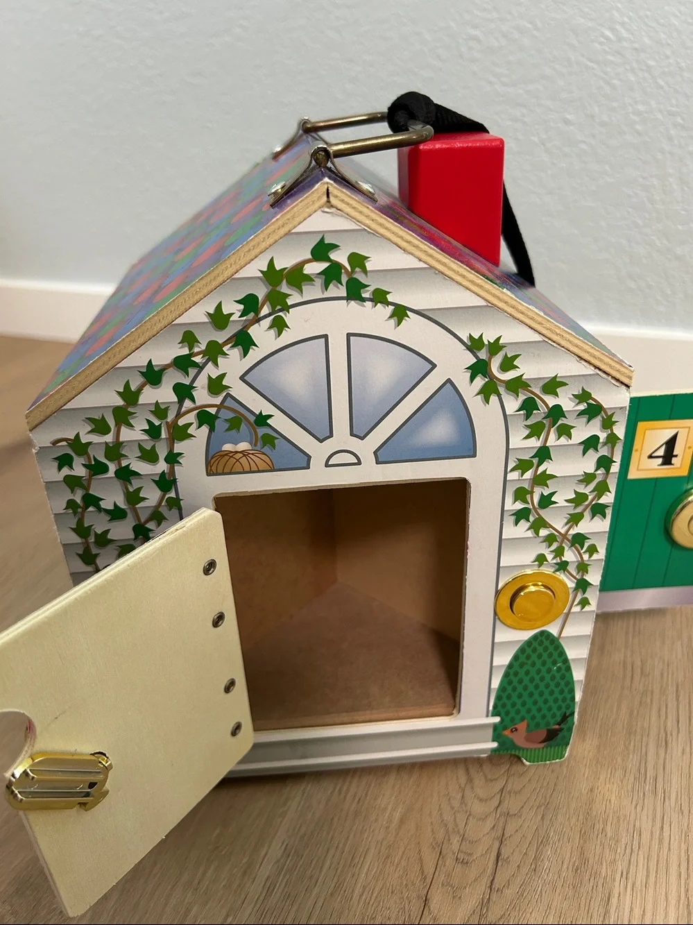 Melissa & DougTake-Along Wooden Doorbell Dollhouse -Doorbell Sounds, Keys-Toy